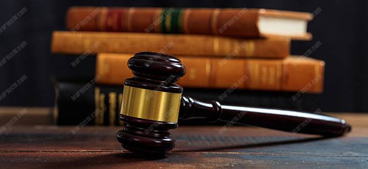 judge gavel on a wooden desk and law books