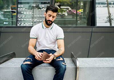 man sitting checking his money