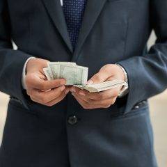 Businessman with dollar currencies