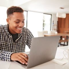 male-teenager-using-a-laptop